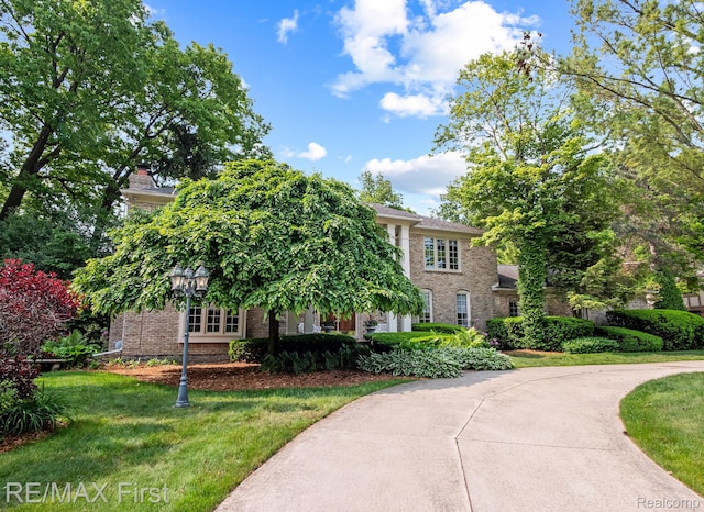 2983 Woodcreek Way, Bloomfield Hills, MI 48304 - view of front of home featuring brick siding and a front lawn