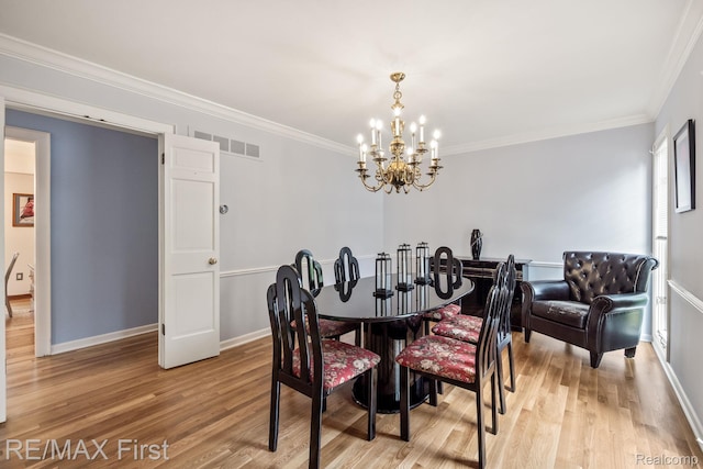 2983 Woodcreek Way, Bloomfield Hills, MI 48304 - dining area with light wood-type flooring, a chandelier, baseboards, and crown molding