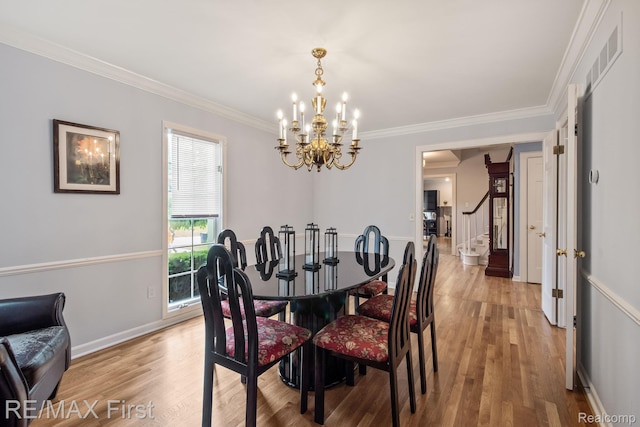 2983 Woodcreek Way, Bloomfield Hills, MI 48304 - dining space featuring a chandelier, light wood finished floors, crown molding, stairway, and baseboards