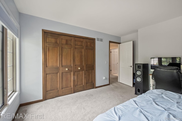 2983 Woodcreek Way, Bloomfield Hills, MI 48304 - bedroom with carpet floors, baseboards, and a closet