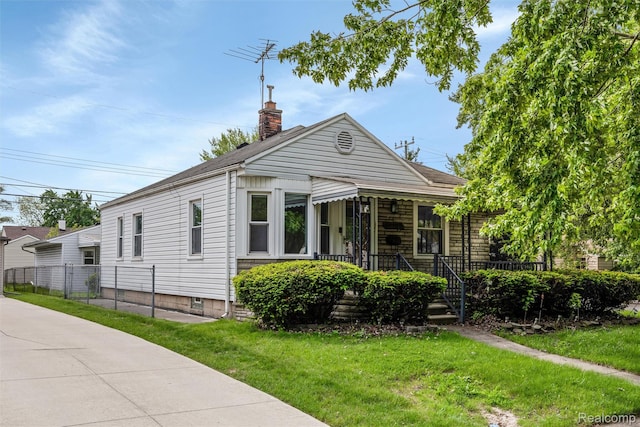 17764 Harman St, Melvindale, MI 48122 - view of front facade featuring a chimney