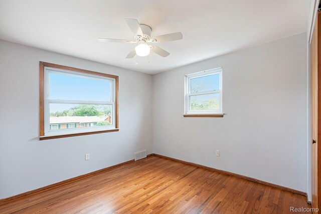 4772 Marian Ave, Warren, MI 48092 - empty room featuring light wood-style flooring, baseboards, and a ceiling fan