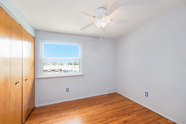 4772 Marian Ave, Warren, MI 48092 - unfurnished bedroom featuring a closet, light wood-style floors, baseboards, and a ceiling fan