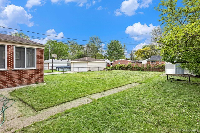 4772 Marian Ave, Warren, MI 48092 - view of yard with a garage and an outbuilding