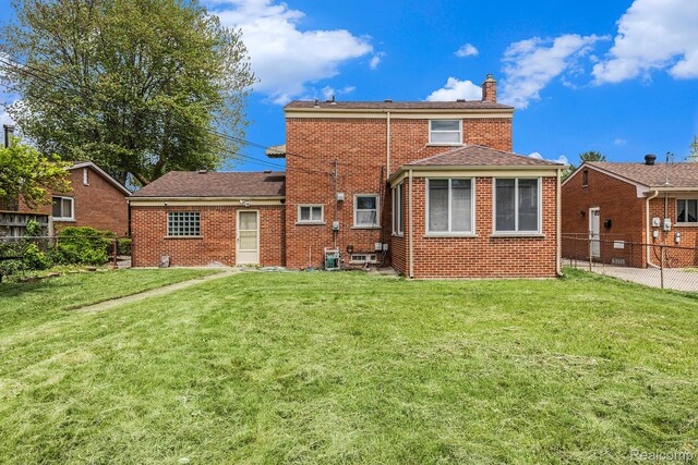 4772 Marian Ave, Warren, MI 48092 - rear view of property featuring a chimney and brick siding