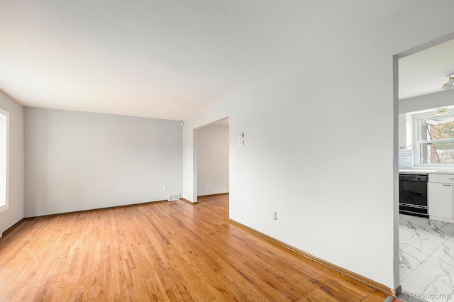 4772 Marian Ave, Warren, MI 48092 - unfurnished room featuring baseboards and light marble finish floors