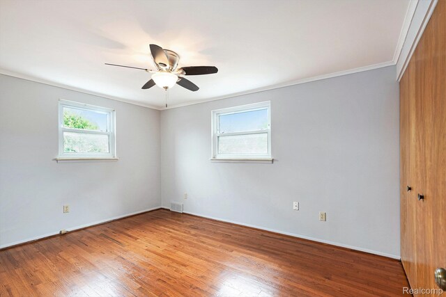 4772 Marian Ave, Warren, MI 48092 - empty room featuring wood finished floors, ornamental molding, ceiling fan, and baseboards