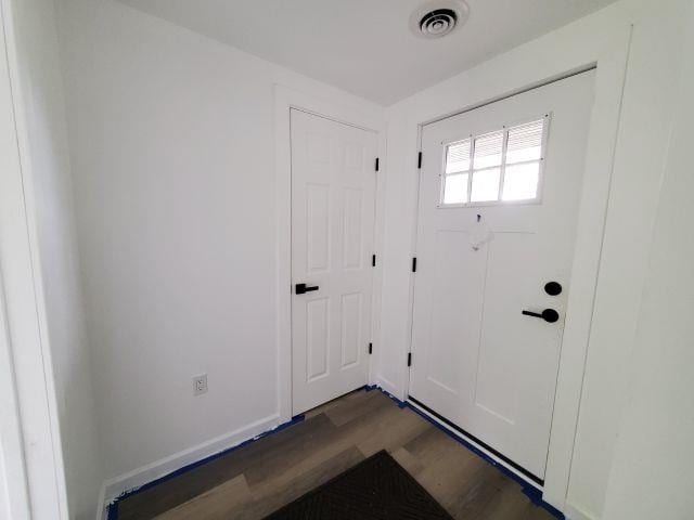 2153 Flowage Lake Rd, West Branch, MI 48661 - doorway with wood finished floors and baseboards