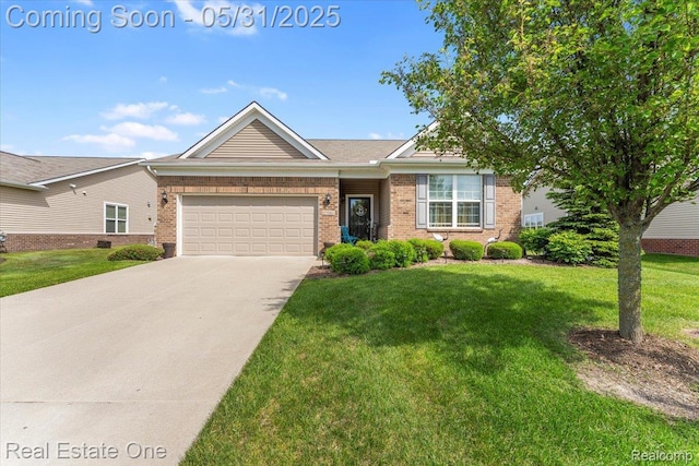 23893 Manistee Ln, Flat Rock, MI 48134 - view of front of home with a garage, brick siding, a front yard, and concrete driveway