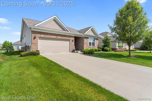 23893 Manistee Ln, Flat Rock, MI 48134 - ranch-style home featuring brick siding, driveway, an attached garage, and a front lawn