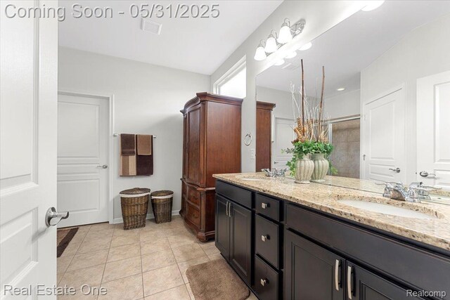 23893 Manistee Ln, Flat Rock, MI 48134 - full bath featuring double vanity, tile patterned floors, and a tile shower