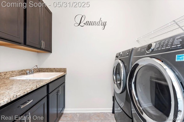 23893 Manistee Ln, Flat Rock, MI 48134 - laundry room featuring separate washer and dryer, cabinet space, and baseboards