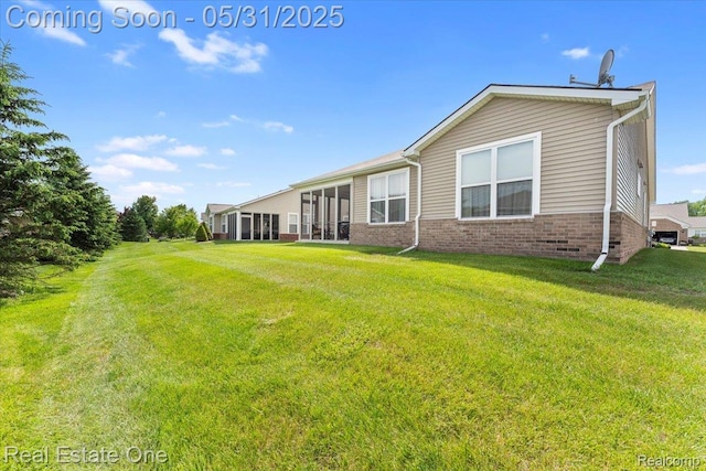 23893 Manistee Ln, Flat Rock, MI 48134 - back of house with brick siding and a lawn