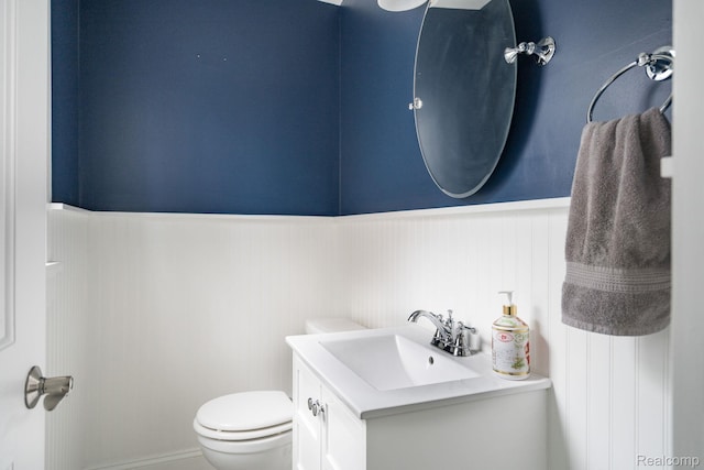 1978 Wiltshire Rd, Berkley, MI 48072 - half bathroom featuring vanity, wainscoting, and toilet