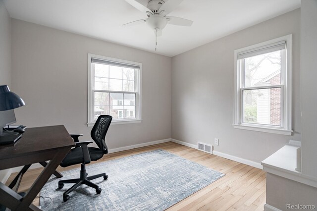1978 Wiltshire Rd, Berkley, MI 48072 - home office featuring light wood-style flooring, baseboards, and a ceiling fan