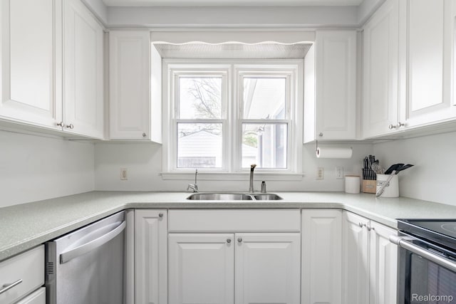 1978 Wiltshire Rd, Berkley, MI 48072 - kitchen with stainless steel dishwasher, a sink, white cabinets, and light countertops