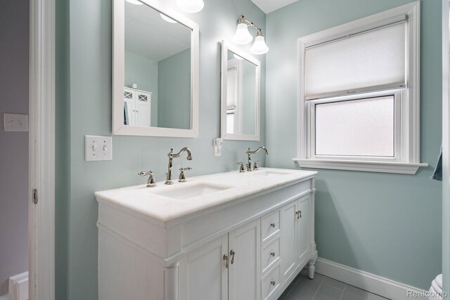 1978 Wiltshire Rd, Berkley, MI 48072 - bathroom with double vanity, baseboards, and tile patterned flooring