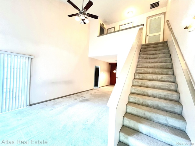25727 Maritime Cir S, Harrison Township, MI 48045 - stairs featuring a ceiling fan, a high ceiling, carpet, and baseboards