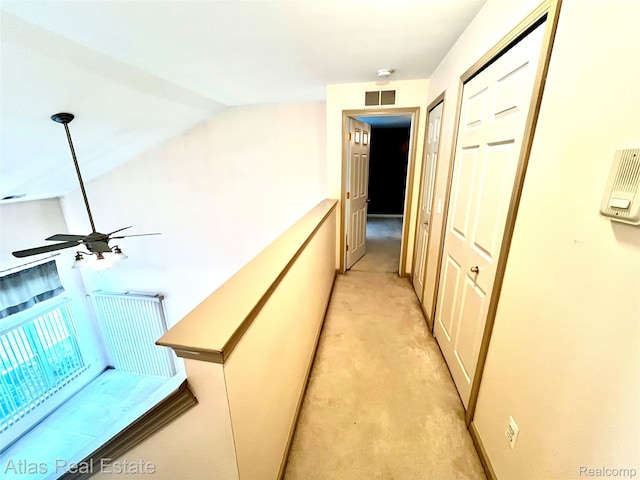 25727 Maritime Cir S, Harrison Township, MI 48045 - corridor featuring light colored carpet and vaulted ceiling