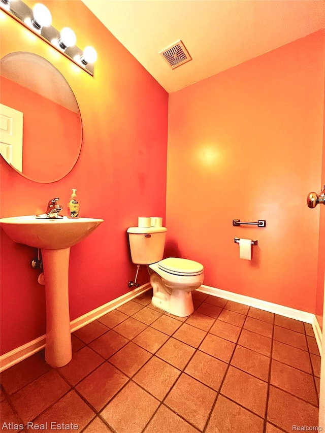 25727 Maritime Cir S, Harrison Township, MI 48045 - half bath with tile patterned flooring, toilet, and baseboards