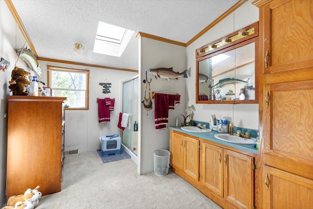 1818 E 58th St, Newaygo, MI 49337 - full bath with a skylight, crown molding, a stall shower, double vanity, and a textured ceiling