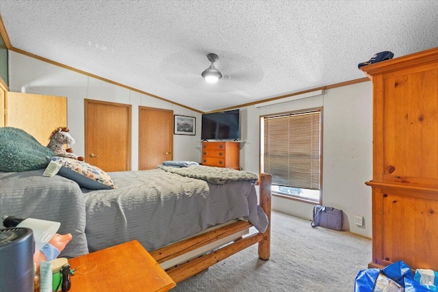 1818 E 58th St, Newaygo, MI 49337 - bedroom featuring crown molding, vaulted ceiling, carpet floors, ceiling fan, and a textured ceiling