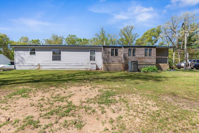 1818 E 58th St, Newaygo, MI 49337 - back of property with central AC and a lawn