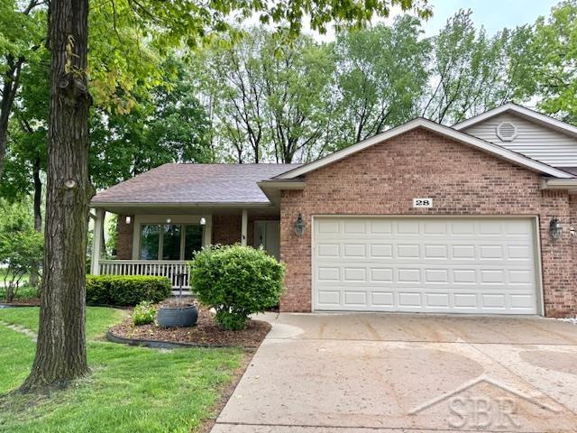 28 Barrington Cir, Saginaw, MI 48603 - single story home featuring brick siding, an attached garage, concrete driveway, covered porch, and a front lawn