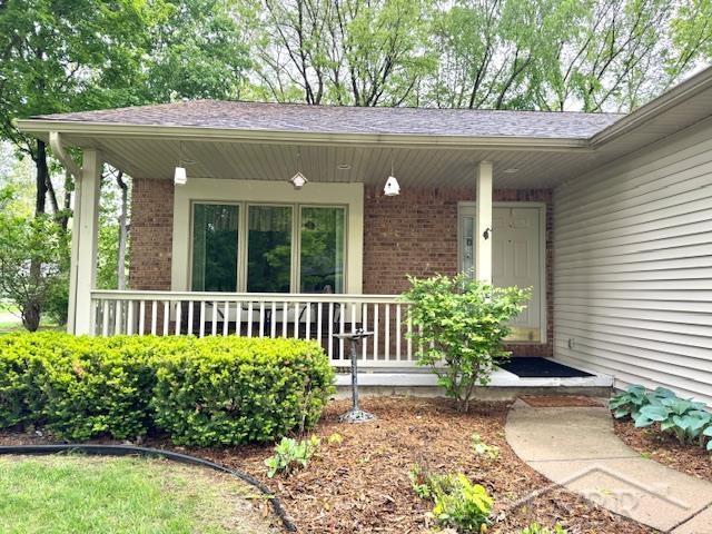 28 Barrington Cir, Saginaw, MI 48603 - entrance to property featuring covered porch and brick siding