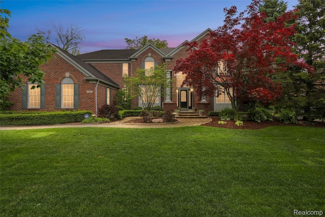 5687 Stonehaven Blvd, Rochester, MI 48306 - view of front of home with a yard and brick siding