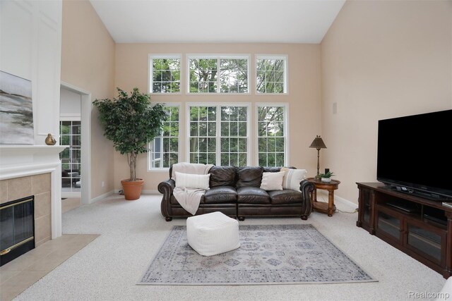 5687 Stonehaven Blvd, Rochester, MI 48306 - carpeted living room with a tiled fireplace and baseboards