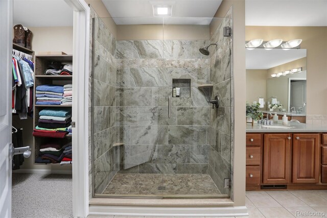 5687 Stonehaven Blvd, Rochester, MI 48306 - full bathroom with vanity, a stall shower, and a walk in closet