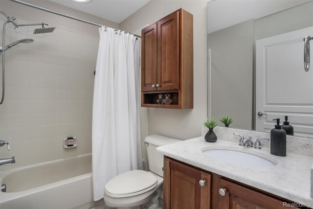 5687 Stonehaven Blvd, Rochester, MI 48306 - full bathroom with vanity, toilet, and shower / bath combo with shower curtain
