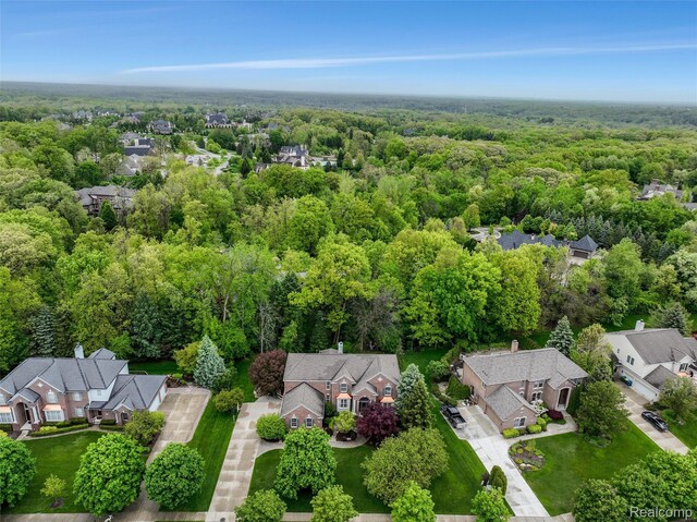 5687 Stonehaven Blvd, Rochester, MI 48306 - aerial view of residential area with a heavily wooded area