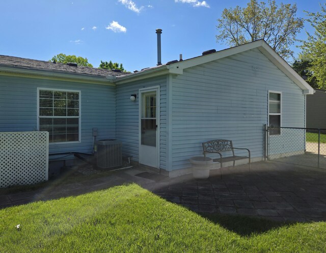 25893 Clark St, Novi, MI 48375 - rear view of house with central air condition unit and a patio