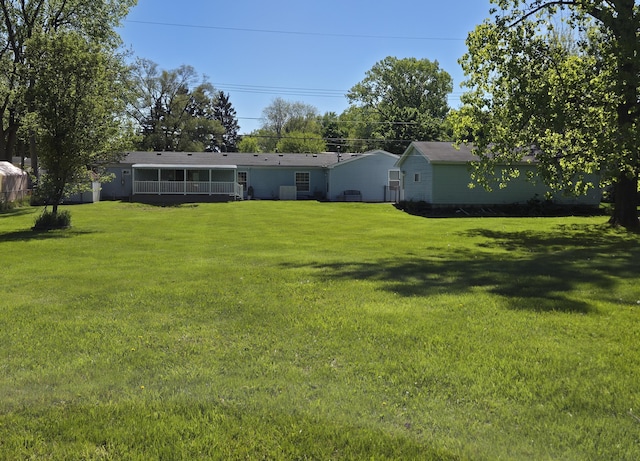 25893 Clark St, Novi, MI 48375 - back of property featuring a yard and a sunroom