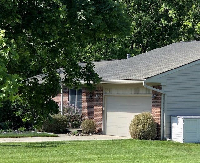 25893 Clark St, Novi, MI 48375 - view of front of house with an attached garage, brick siding, roof with shingles, and a front yard