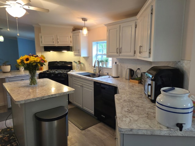 25893 Clark St, Novi, MI 48375 - kitchen featuring black appliances, under cabinet range hood, light countertops, light wood finished floors, and crown molding
