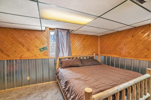 11676 Whitefish Rd, Newaygo, MI 49337 - carpeted bedroom with a paneled ceiling and wood walls