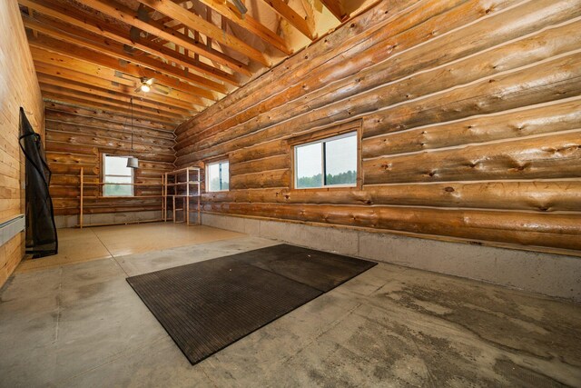 4450 50th Ave, Sears, MI 49679 - misc room featuring rustic walls and concrete floors