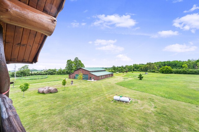4450 50th Ave, Sears, MI 49679 - view of grassy yard featuring an outdoor structure and an outbuilding