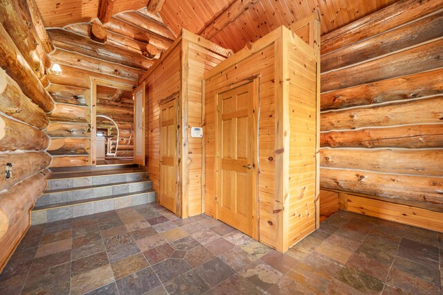 4450 50th Ave, Sears, MI 49679 - staircase featuring stone tile floors and wood ceiling