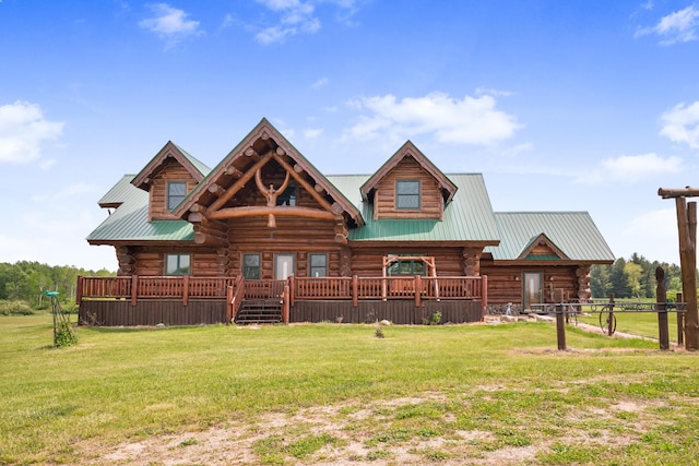 4450 50th Ave, Sears, MI 49679 - log cabin featuring log siding, a front lawn, and metal roof