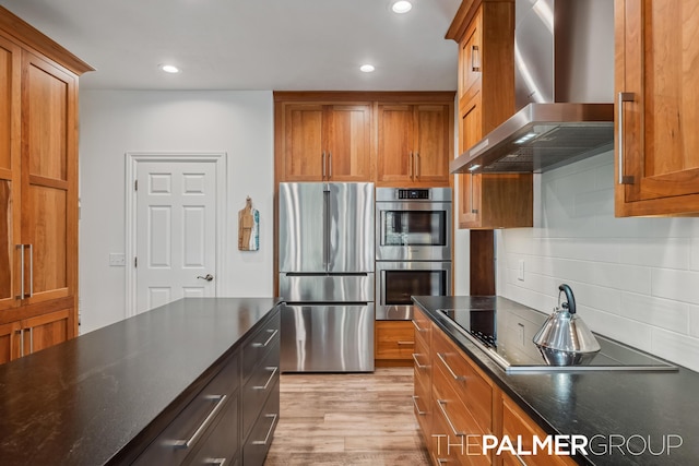 7149 Armadale Ct NE, Belmont, MI 49306 - kitchen featuring stainless steel appliances, wall chimney exhaust hood, brown cabinets, tasteful backsplash, and recessed lighting