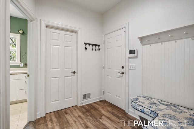 7149 Armadale Ct NE, Belmont, MI 49306 - mudroom with wood finished floors and baseboards