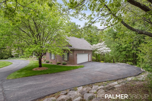 7149 Armadale Ct NE, Belmont, MI 49306 - view of front of house with driveway, brick siding, a garage, a front lawn, and a shingled roof