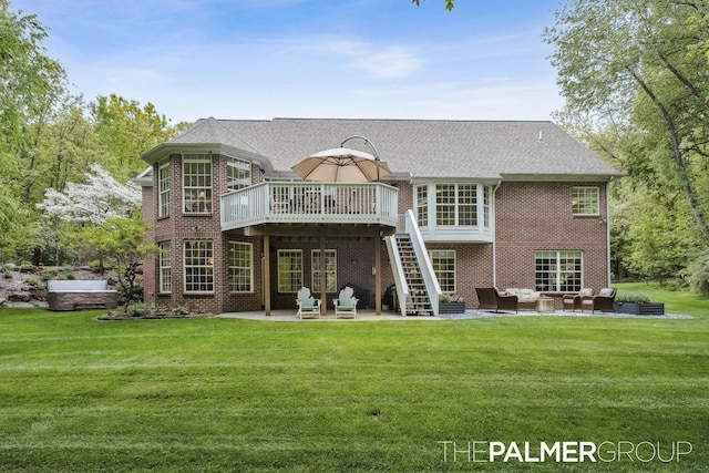 7149 Armadale Ct NE, Belmont, MI 49306 - rear view of house with outdoor lounge area, a patio, a deck, brick siding, and a yard
