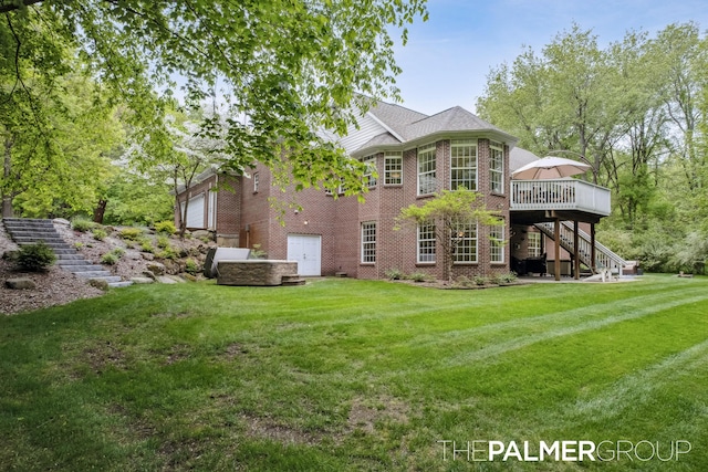 7149 Armadale Ct NE, Belmont, MI 49306 - back of property featuring stairs, brick siding, a wooden deck, a lawn, and a garage