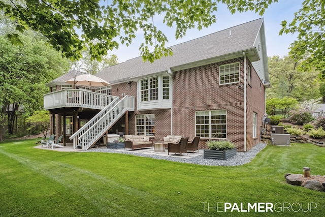 7149 Armadale Ct NE, Belmont, MI 49306 - rear view of property with outdoor lounge area, a deck, a patio, brick siding, and stairway