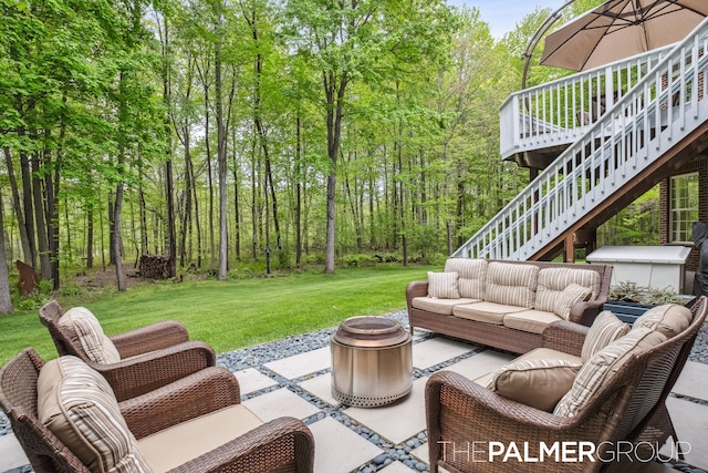 7149 Armadale Ct NE, Belmont, MI 49306 - view of patio / terrace featuring stairway, an outdoor living space with a fire pit, a wooden deck, and a view of trees
